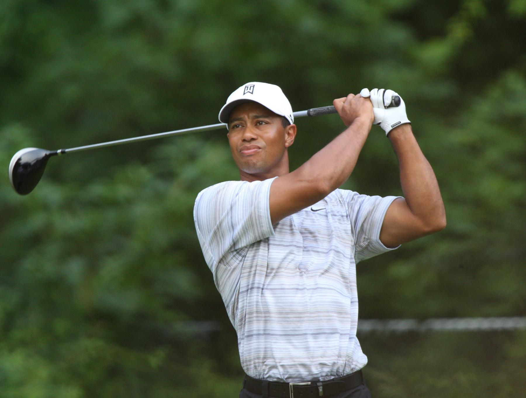 File:Tiger Woods drives by Allison.jpg - a couple of cans of beer and a box of chocolate
